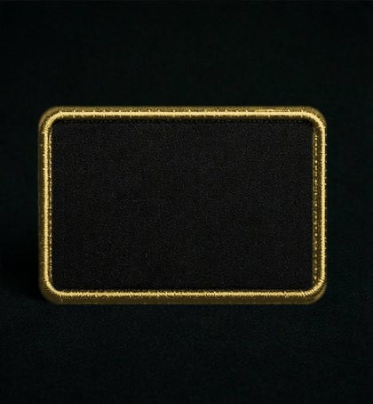 A sponsor patch with gold embroidered trim and nothing on it.